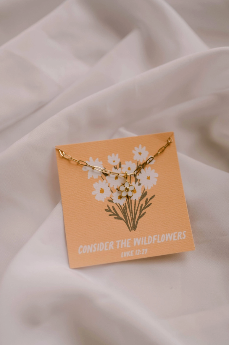 Consider The Wildflowers Christian Charm Necklace from Southern Sunday Boutique in Naples, FL