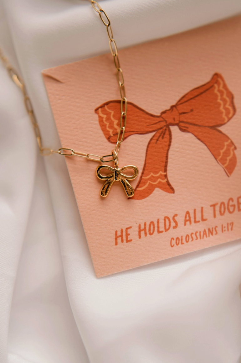 He Holds All Together Christian Charm Necklace from Southern Sunday Boutique in Naples, FL